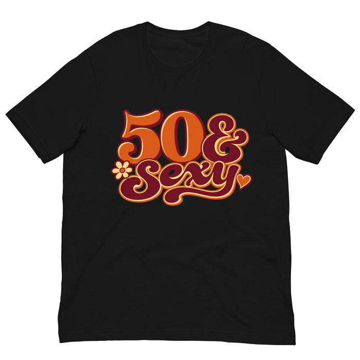 Black 50 & Sexy birthday T-shirt featuring orange and pink retro lettering with small flower and heart accents.